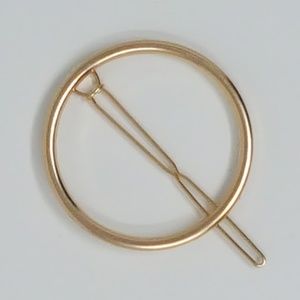 1 gold and 1 silver circle shaped metal hair pin